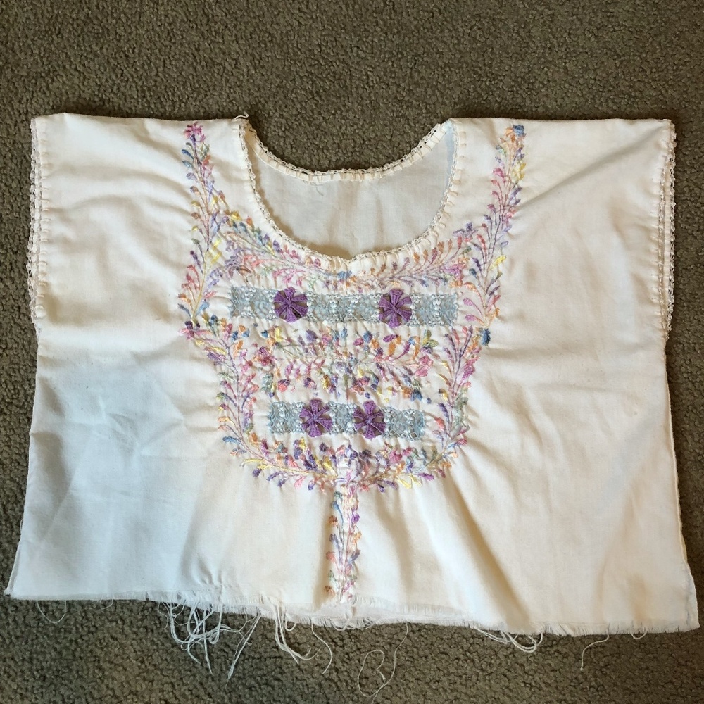 woman's white top with embroidery